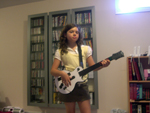 Holly on guitar
